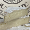Two slices of Brie de Meaux