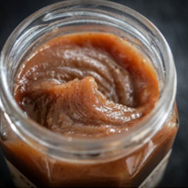 Jar opened showing the smooth & delicate texture of the chestnut spread.