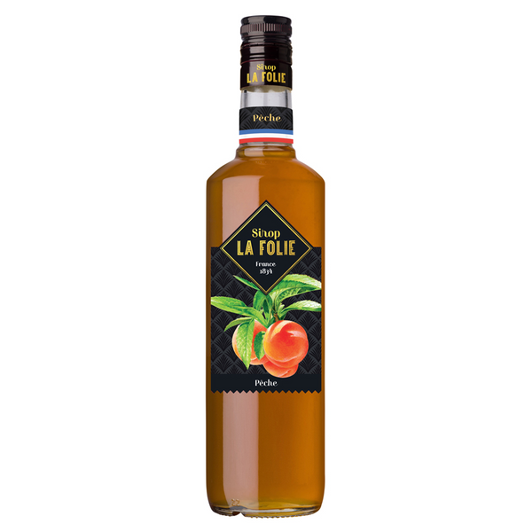 Bottle of Combier Distillery's peach syrup. Net weight: 70cl