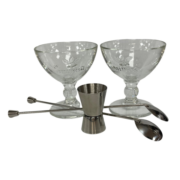 Two top quality stainless steel cocktail spoons, a 2-4cl cocktail measure in the front and two lovely coupes made in France at the back.