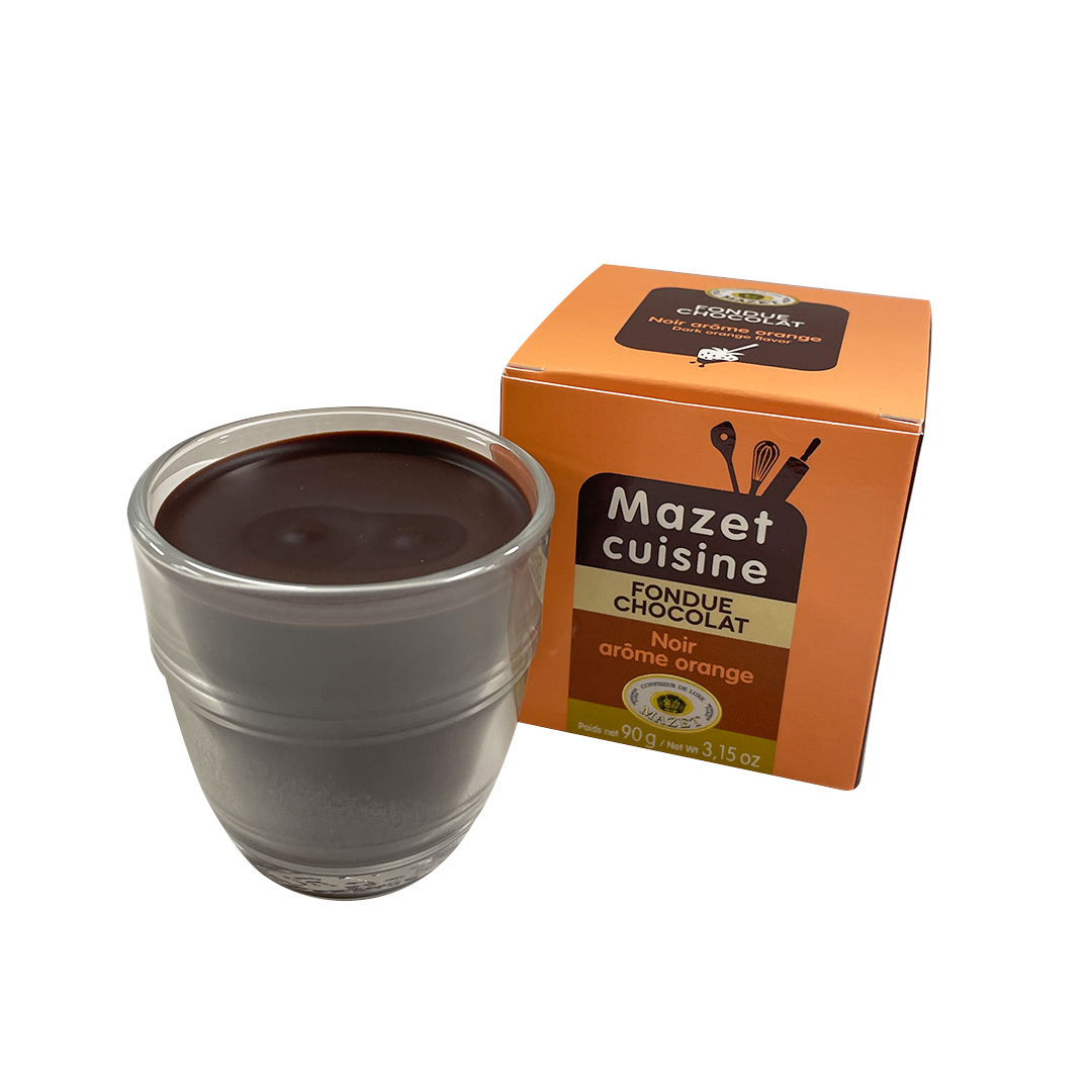Glass of Mazet's fondue with dark chococlate and orange next to the box