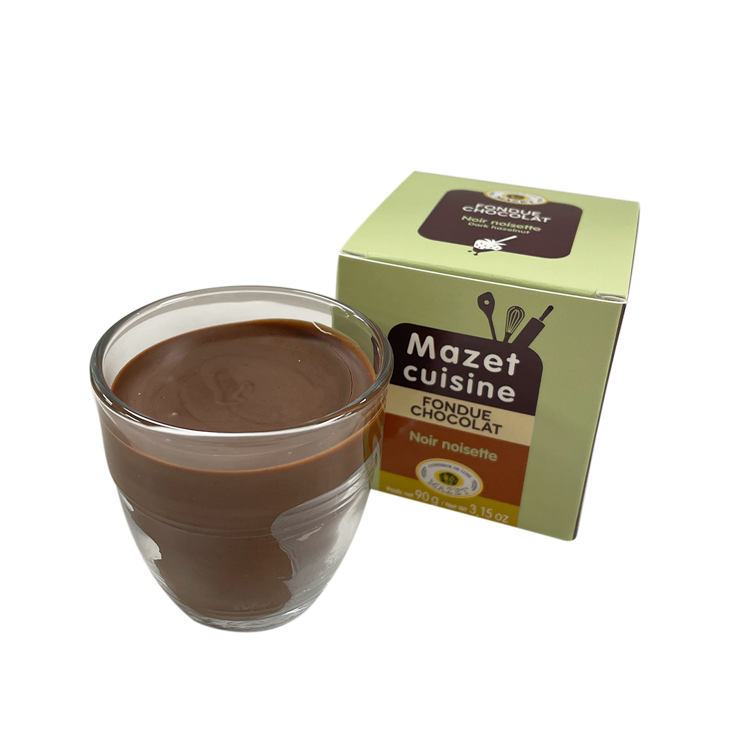 Glass of Mazet's fondue with dark chococlate and hazelnut next to the box