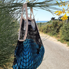 Black-ecru Filt 1860's 100% cotton net shopping bag hung with towel inside