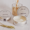 two tins of extreme care cream, one opened, one closed