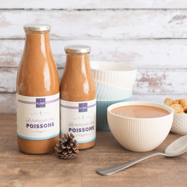 Bottles of La Perle des Dieux' fish soup with some served in a bowl.