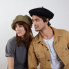 Two models wearing Max berets