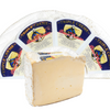 Triple Creme cheese in the background and one slice in the foreground