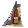 Bottle of Pressoirs de Provence's no-sugar-added sparkling apple juice & Beauvillé's apron