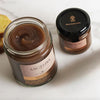 Two jars of Angelina's chestnut spread, the bigger one open in the foreground