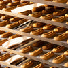 Biscuiterie de Forcalquier's authentic navettes from Provence on racks.