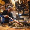 Staff busy grinding the olives in the traditional way.