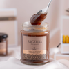 A jar of Angelina Chestnut Cream (Crème de Marrons) with a spoonful being lifted, highlighting its rich and smooth texture.