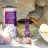 Jar of Maison Bremond 1830's garlic cream displayed with fresh garlic and a bottle of olive oil