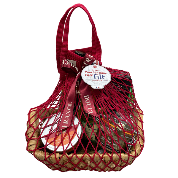 Gourmandises from France Gift Basket wrapped up in a Filt's mesh shopping bag