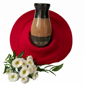 La Parisienne Beret with a bottle of Angelina"s hot chocolate and flowers in the foreground