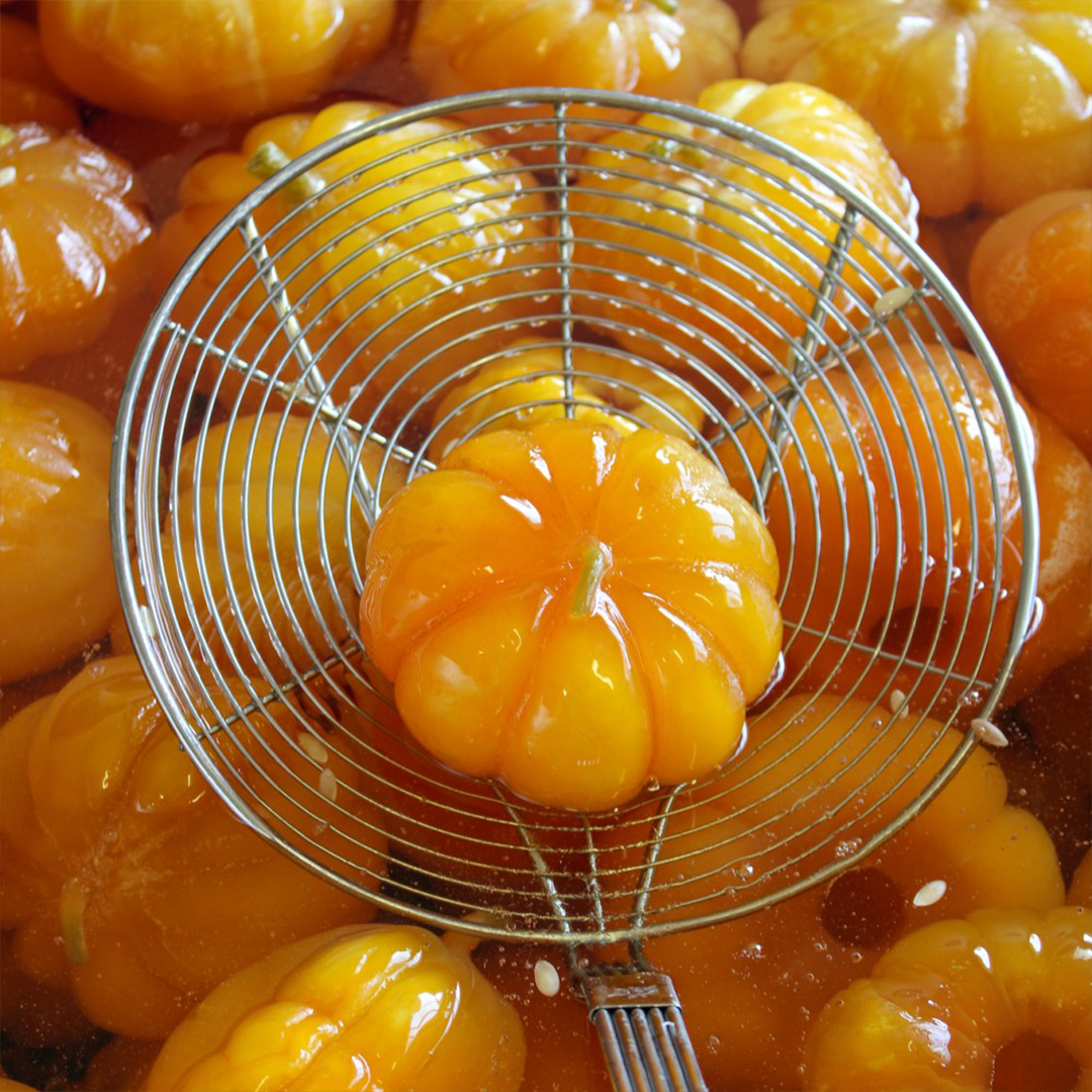 Cantaloup melon being candied at Léonard Parli's workplace.