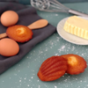 Jeannette 1850 madeleines near some butter and eggs