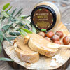 Maison Bremond 1830's organic hazelnut spread with olive oil spread on bread with fresh hazelnuts on the side.