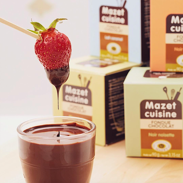 Strawberry dipped in a Mazet's French chocolate fondue