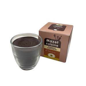 Glass of Mazet's fondue with dark bitter chococlate next to the box