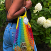 Rainbow Filt 1860's net shopping bag carried by someone 