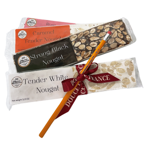 4 bars of nougat: white smooth, black, caramel and rose with a pen on top