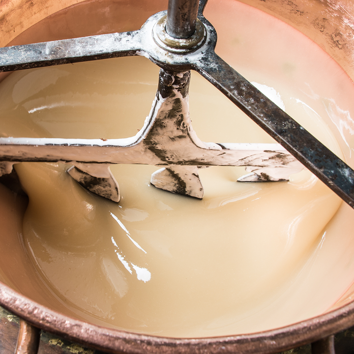 Preparation of the mixture of egg, honey &amp; sugar in a copper cauldron at Jonquier&