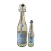 Two bottles of Elixia plain lemonade, one small 33cl, one large 75cl