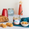 Jar of tuna rillettes with Kampot pepper with some rillettes on toasts and in a bowl