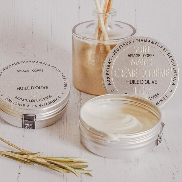 two tins of extreme care cream, one opened, one closed