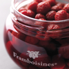 Close up on opened jar of Distilleries Peureux' framboisines. Net weight: 390g