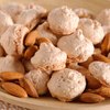 Fossier's almond macarons on a dish with fresh almond.