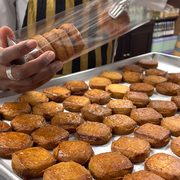 Douce France staff busy packing pure butter palets bretons with caramel baked in house.