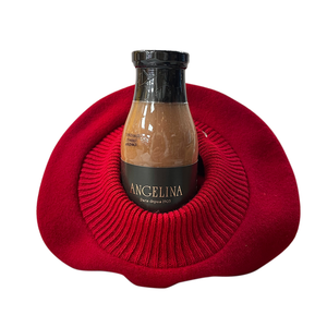 A bottle of Angelina's hot chocolate with La Parisienne Béret