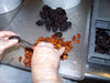 Favols' staff removing the pit of the plum-prunes